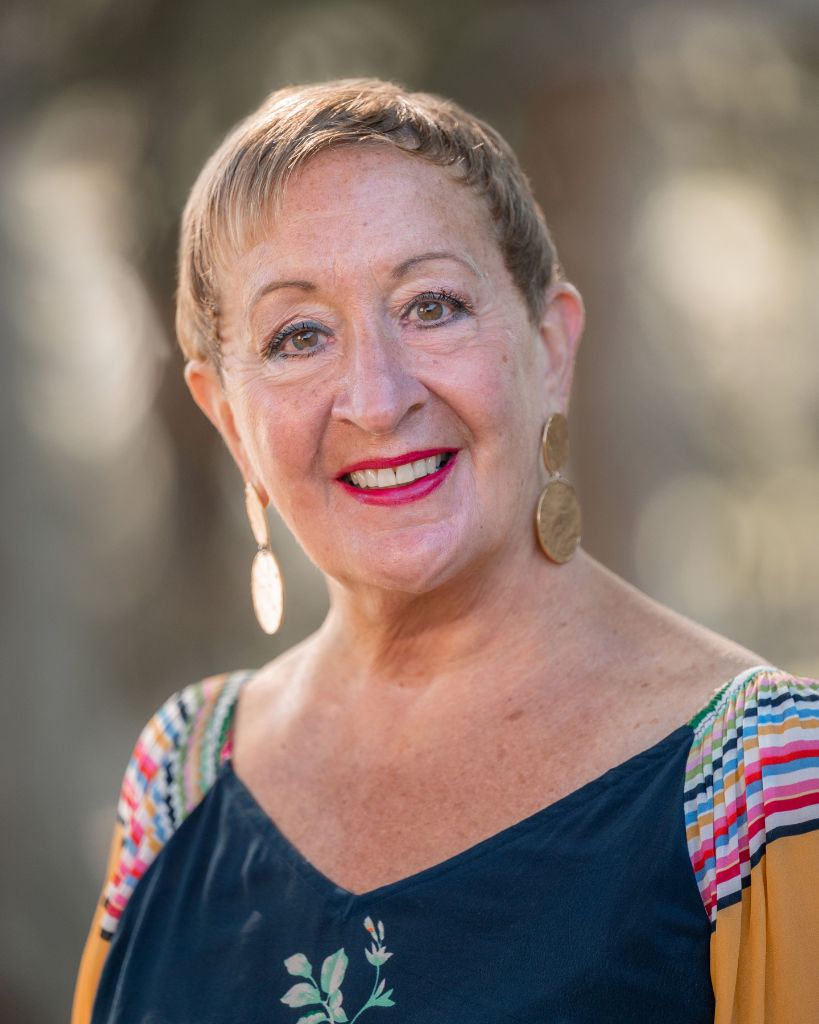 Donna Milani Luther - Professional portrait showcasing her warm, confident leadership style